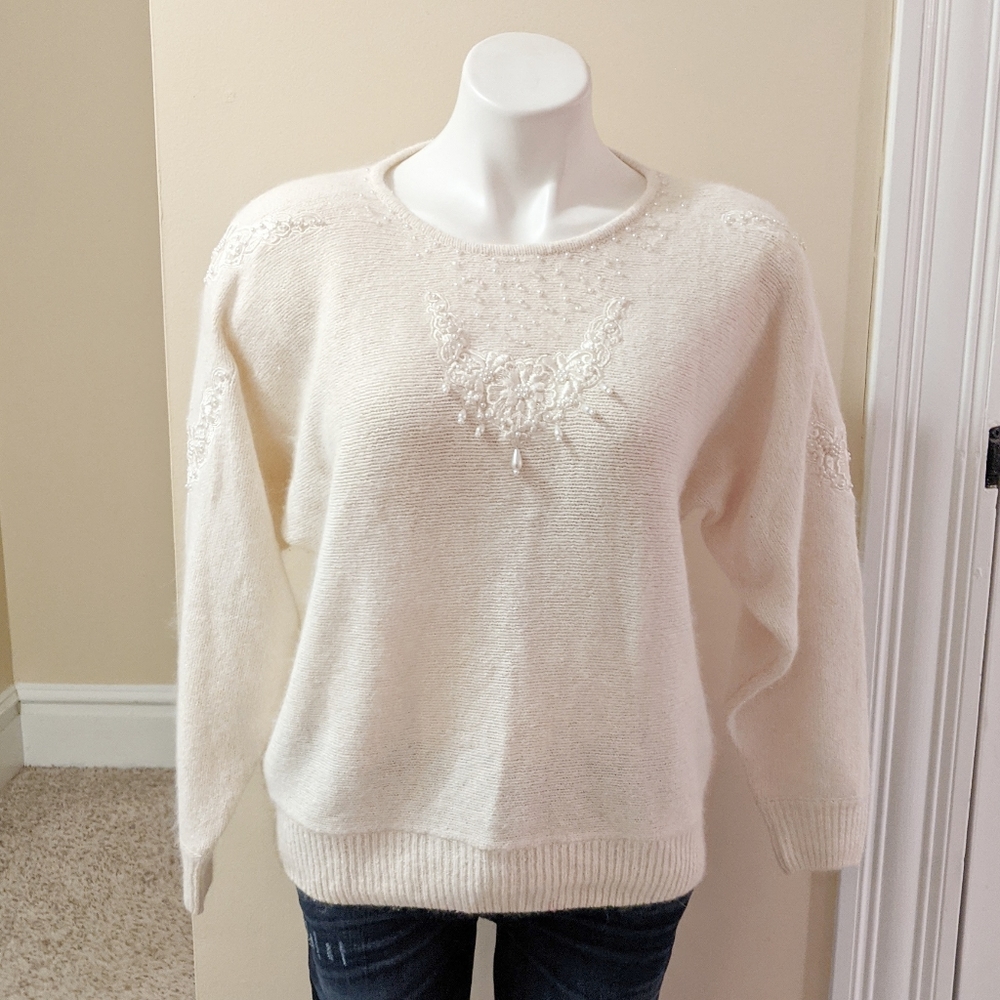 Vintage Dividend's cream beaded sweater.